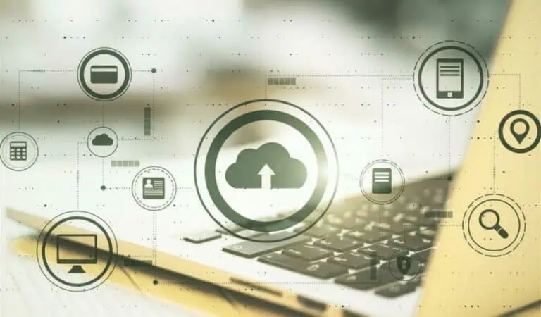 Digital cloud backup concept with icons representing data storage, recovery, and security on a laptop keyboard background.